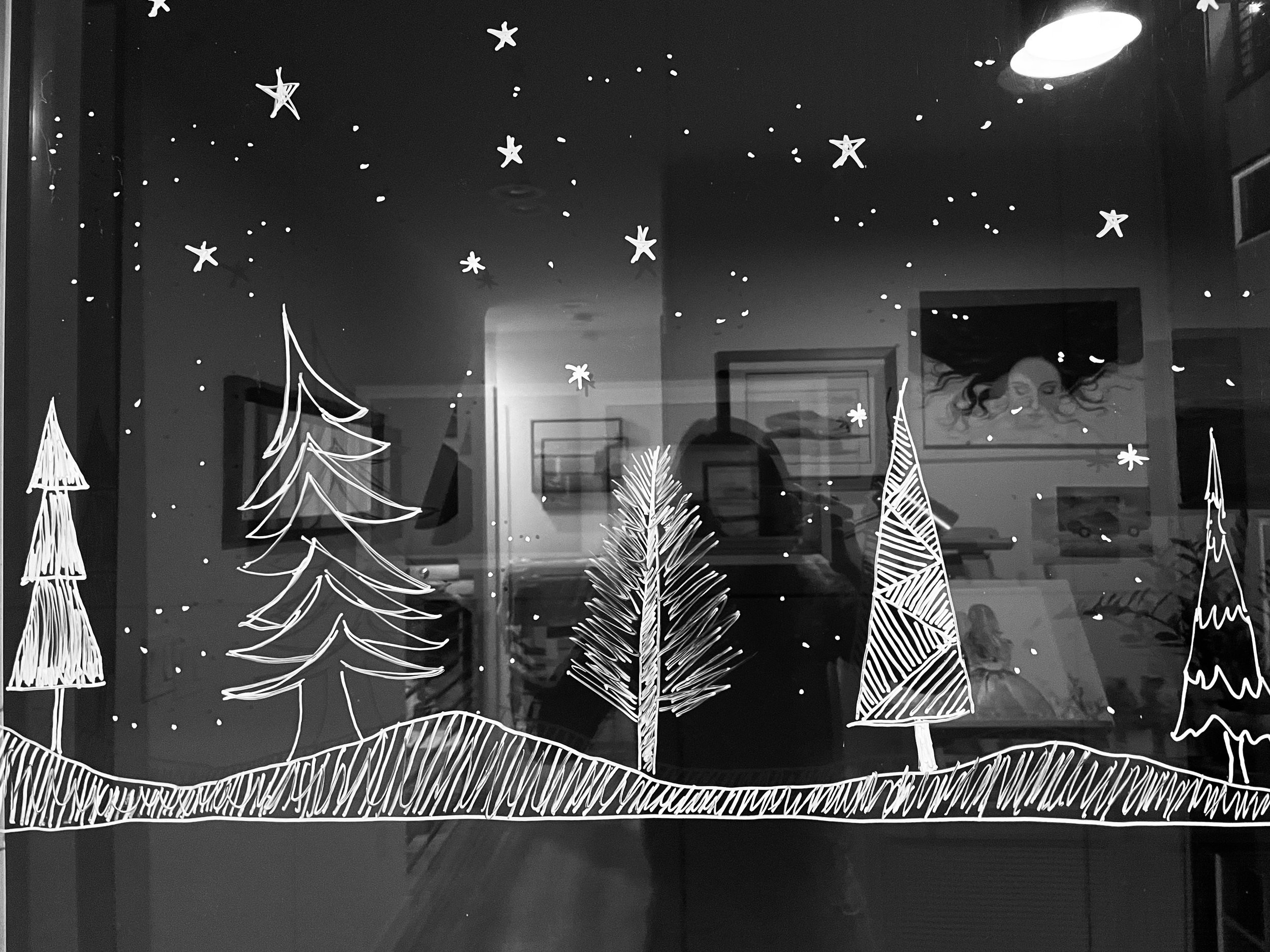Holiday window art drawn with liquid chalk.